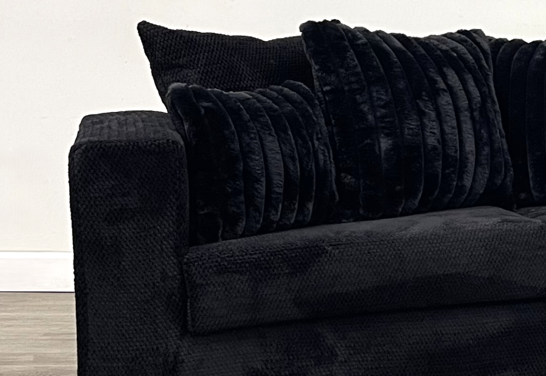 Black L Sectional with Teddy Bear Upholstery and Corduroy Pillows